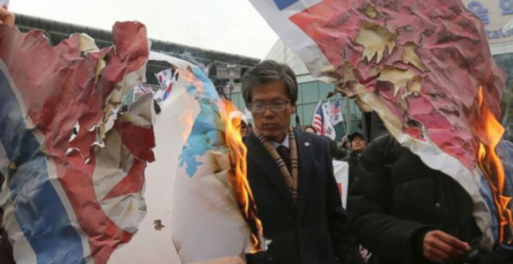 Spalili sliku Kim Džong Una